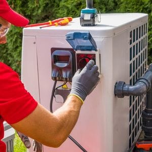 AC Maintenance Houston - Technician cleaning air conditioner coils